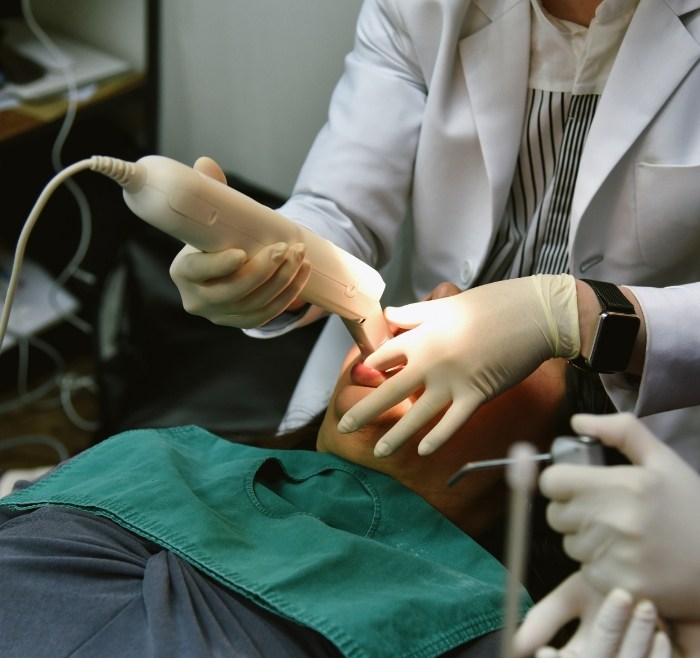 Dental patient having digital impressions taken of their teeth