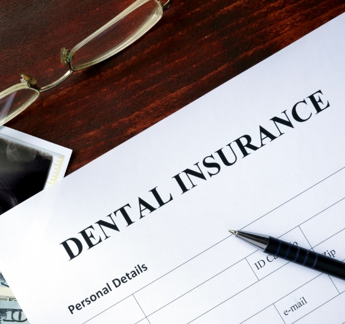 Dental insurance paperwork on desk