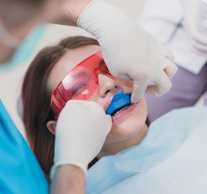 Dental patient having fluoride applied to their teeth